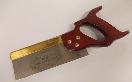 Hand tool with a blade extending from the handle and running parallel.