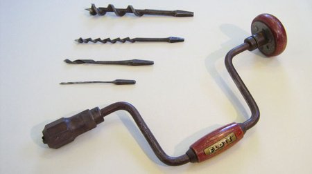 A u-shaped hand tool with two handles and a pointed head.